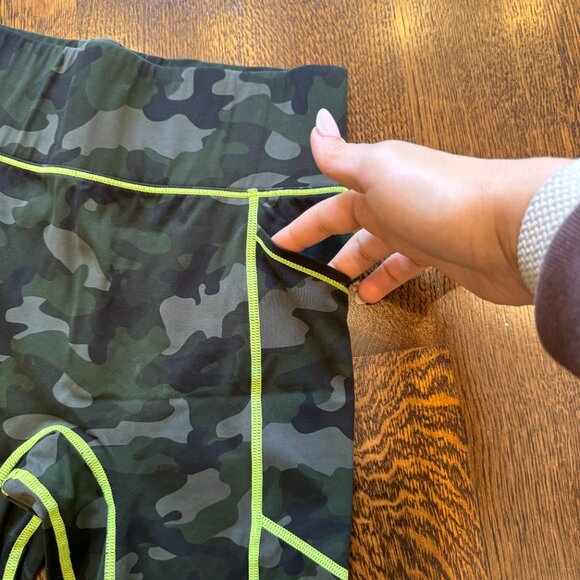 Bandier x All Access Center Stage Pocket Biker Short in Olive Camo - Picture 5 of 7